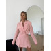 A trendy 2-piece suit, a skirt-shorts and a cropped jacket is your perfect option