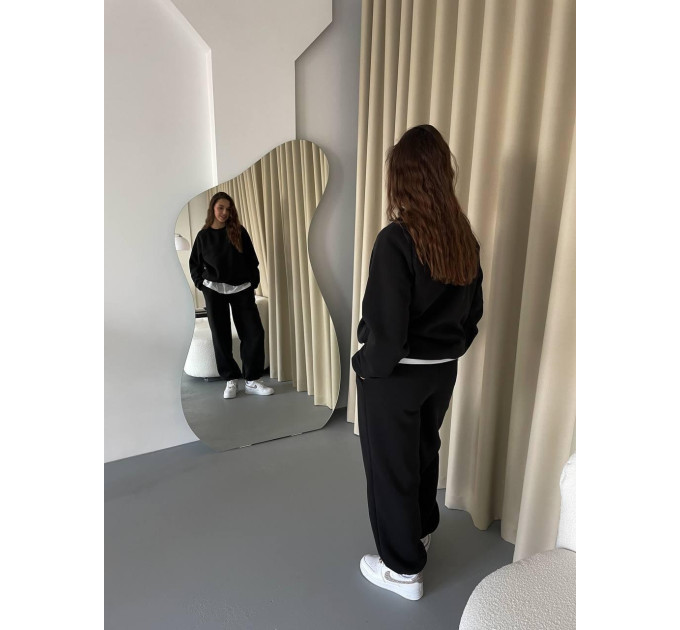 Stylish women's sports suit with an oversized cut