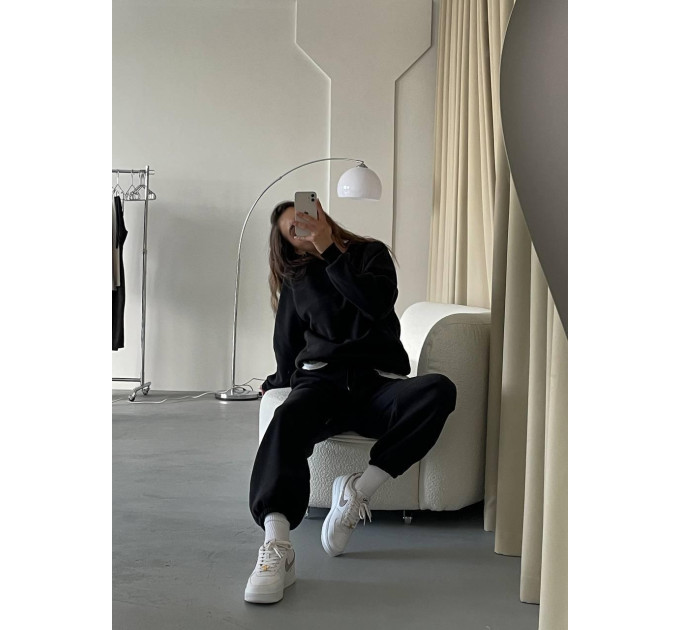 Stylish women's sports suit with an oversized cut