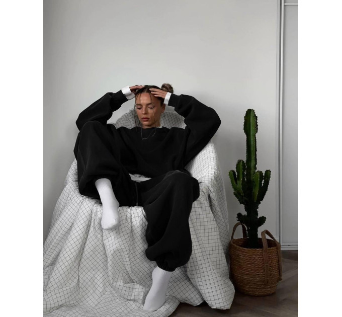 Stylish women's sports suit with an oversized cut